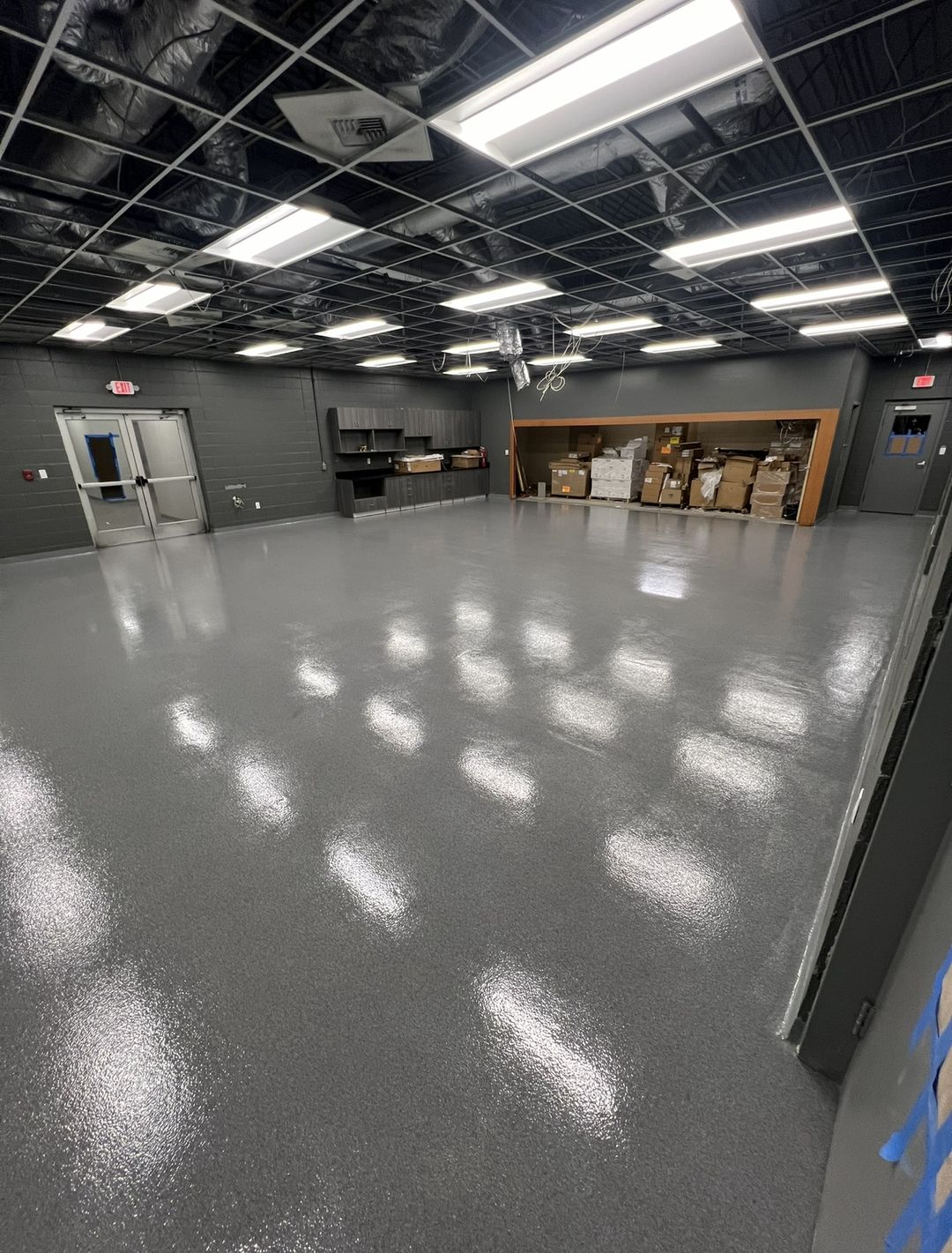 The same room finished with a high-gloss grey flake epoxy floor